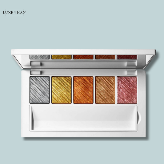 Makeup by mario master metals eyeshadow palette featuring six vibrant shades: silver, gold, orange, and pink, set in a sleek white case.