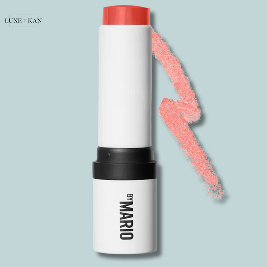 A peach-colored oft pop blush stick with a sleek white design, accompanied by a swatch of the blush.