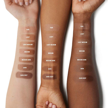 Three arms showcasing a range of skin tone swatches labeled from fair to dark deep, highlighting foundation shades for diverse complexions.