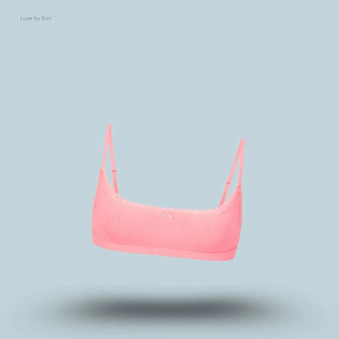 SKIMS Lightweight Cotton Pointelle Scoop Bralette in Melon Tonal, flat lay on light blue background
