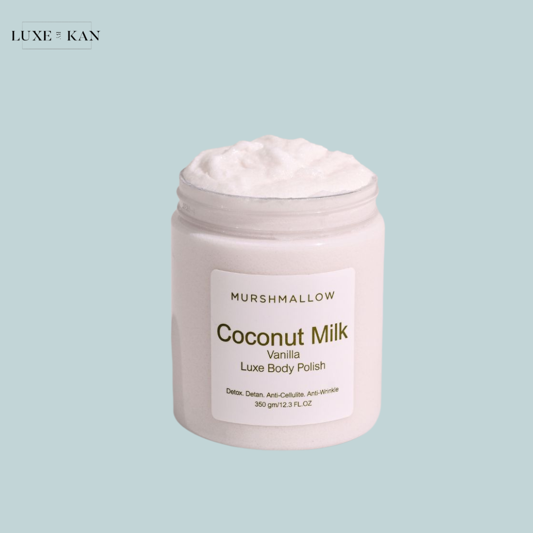 A jar of Murshmallow Coconut Milk Vanilla Luxe Body Polish with a creamy texture, labeled with detox and anti-cellulite benefits.