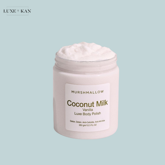 A jar of Murshmallow Coconut Milk Vanilla Luxe Body Polish with a creamy texture, labeled with detox and anti-cellulite benefits.