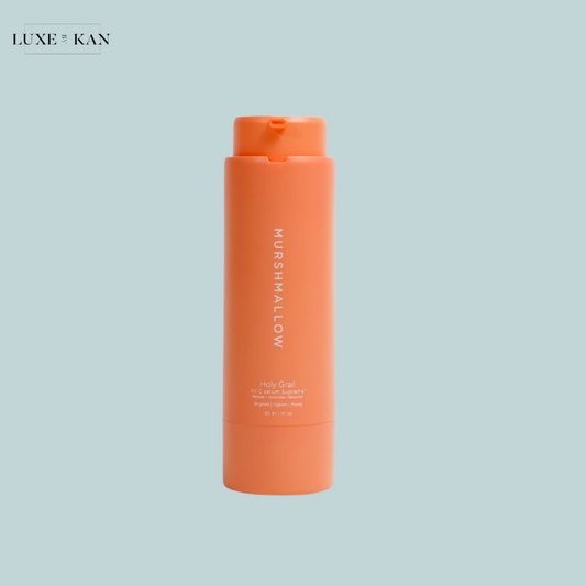 Orange bottle of Murshmallow's Holy Grail skincare product.
