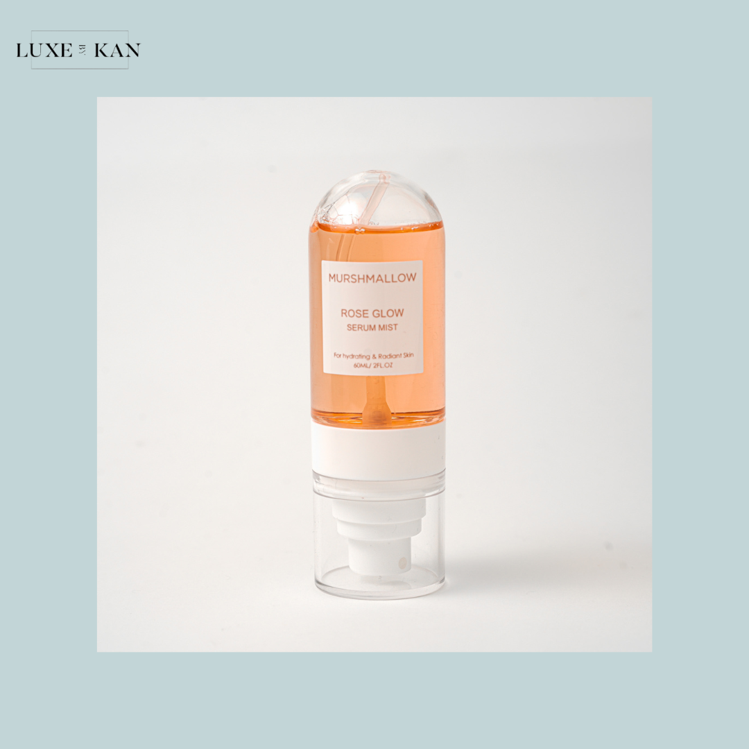Bottle of Murshmallow Rose Glow Serum Mist with pink liquid.