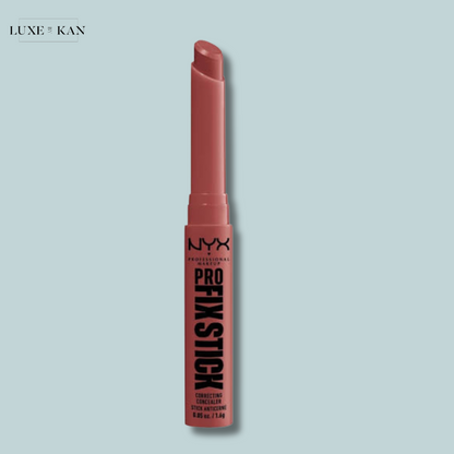 The NYX Cosmetics Pro Fix Stick Concealer is a peach-toned correcting stick with the product exposed, on a pale blue background.