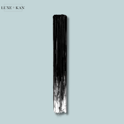 A vertical brush stroke in black and white against a light blue background, showcasing a sleek and artistic design.