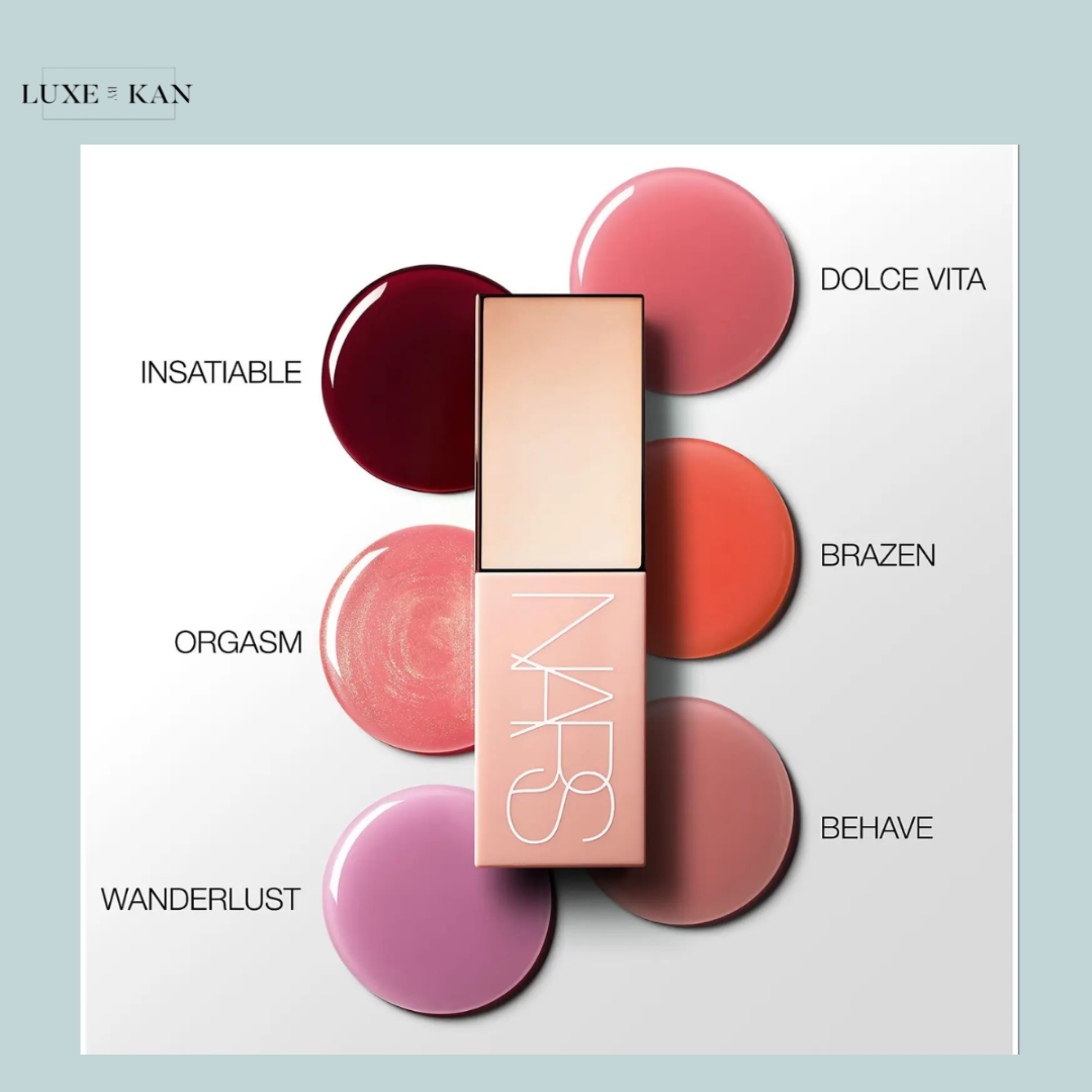 A NARS lip product surrounded by six vibrant shades: Insatiable, Orgasm, Dolce Vita, Brazen, Behave, and Wanderlust.