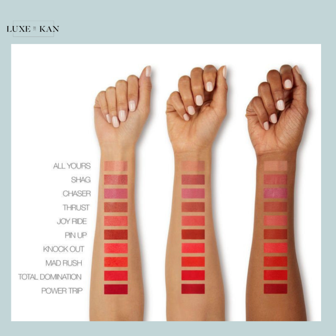 Three arms showcasing various lipstick swatches, ranging from soft pinks to deep reds, labeled with names like "Joy Ride" and "Power Trip."