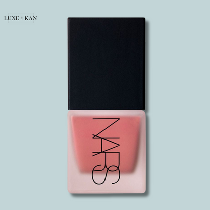 NARS liquid blush in a sleek, transparent container with a black cap, showcasing a soft pink shade.