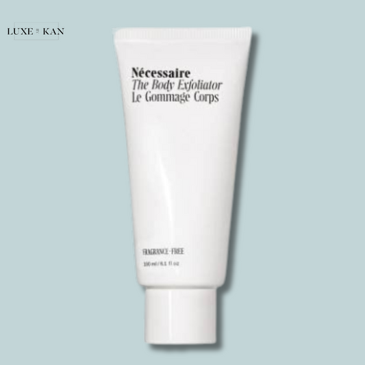 White tube of Nécessaire The Body Exfoliator with a minimalist design, labeled "Fragrance-Free".