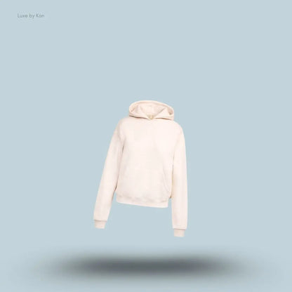 SKIMS Cotton Fleece Classic Hoodie in Oatmeal Heather, flat lay on light blue background