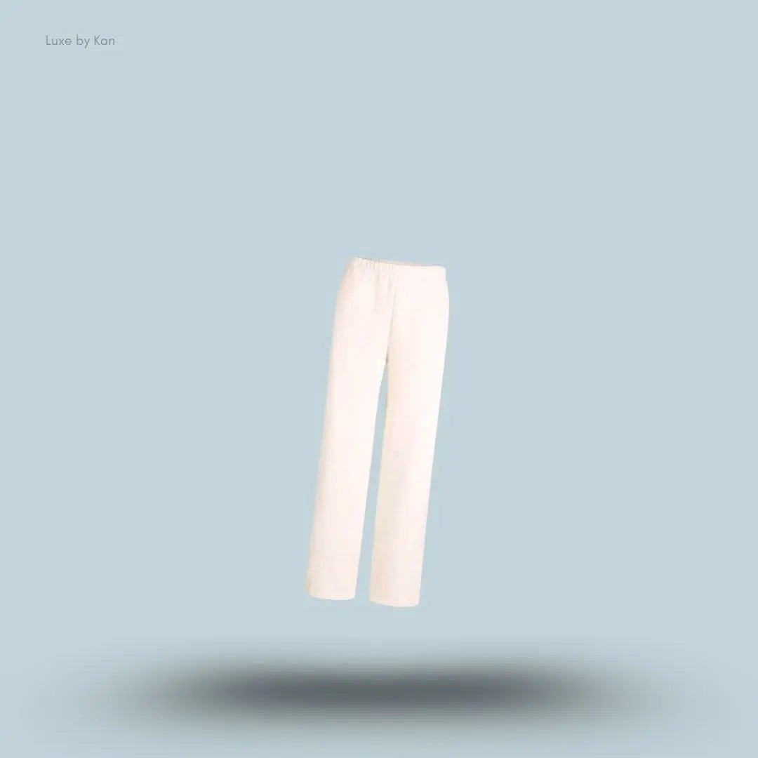 SKIMS Cotton Fleece Classic Straight Leg Pant in Oatmeal Heather, flat lay on light blue background