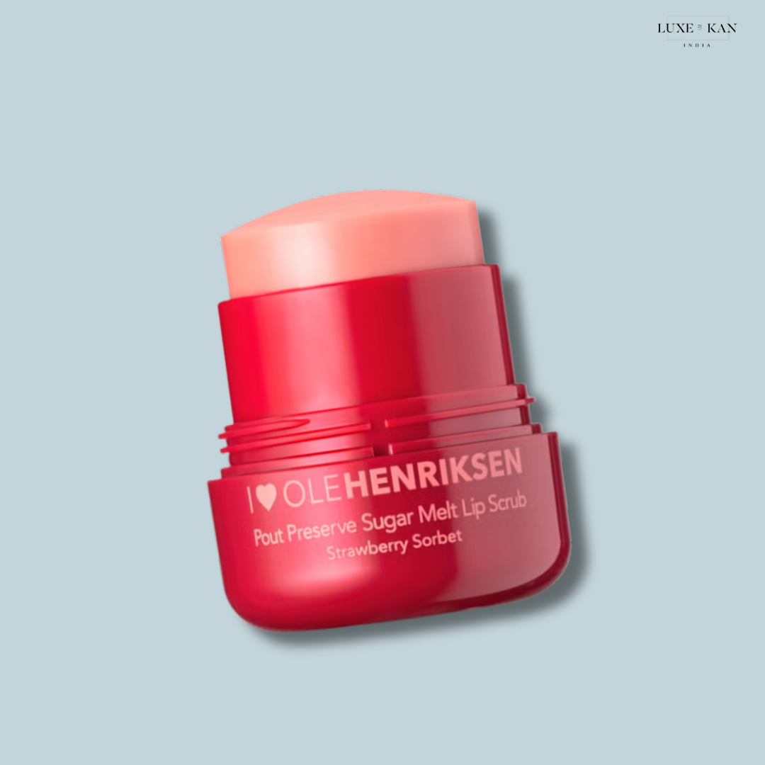 Ole Henriksen Pout Preserve Sugar Melt Lip Scrub in Strawberry Sorbet in a red container on a light blue background.