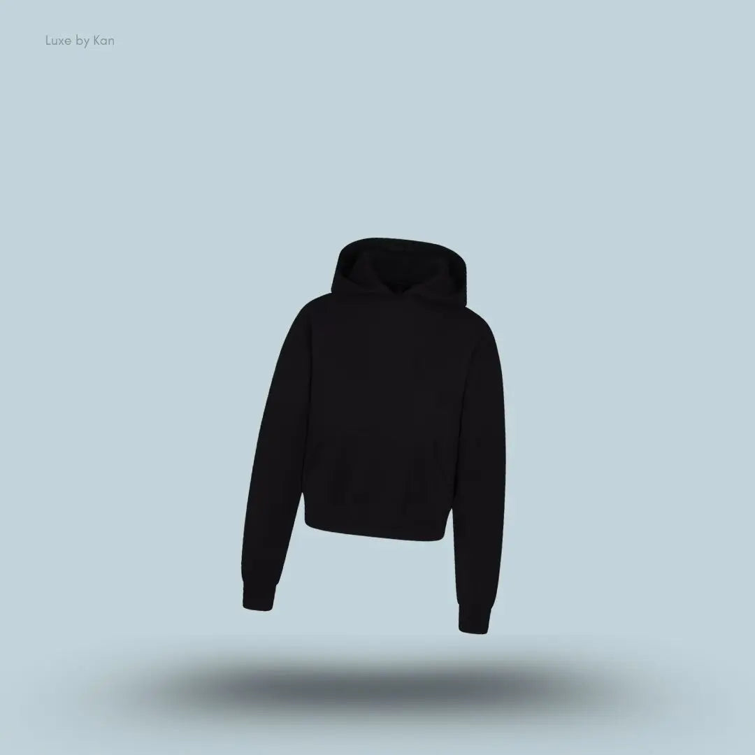 SKIMS Cotton Fleece Classic Hoodie in Onyx, flat lay on light blue background