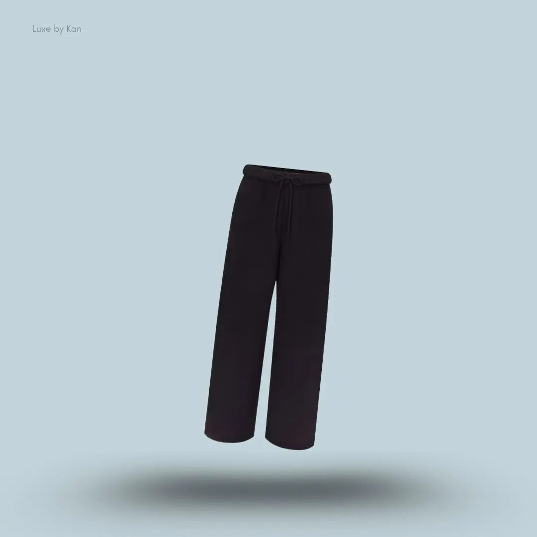 SKIMS Cotton Fleece Classic Straight Leg Pant in Onyx, flat lay on light blue background