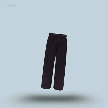 SKIMS Cotton Fleece Classic Straight Leg Pant in Onyx, flat lay on light blue background