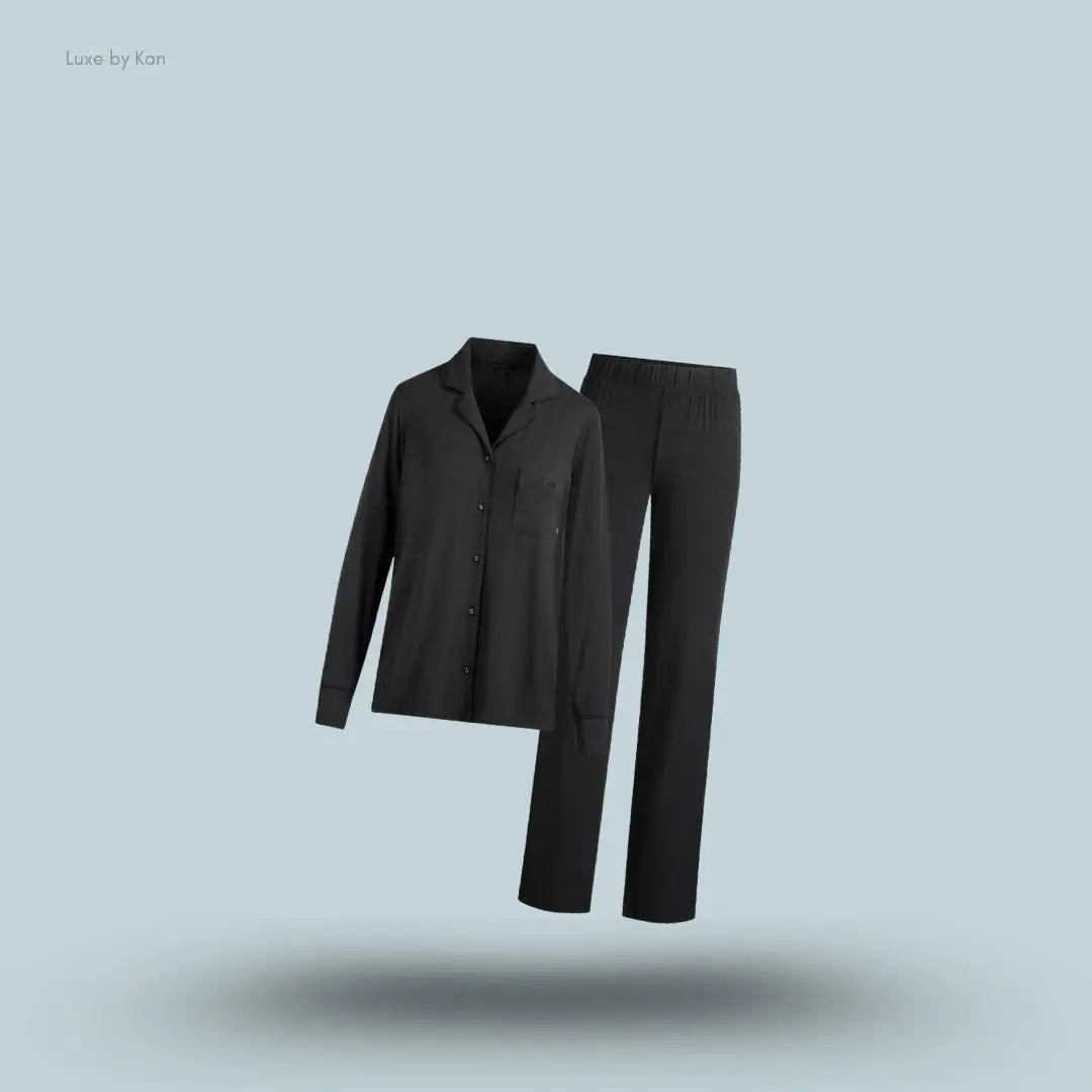 SKIMS Sleep Long Sleeve Button Up Set in Onyx, flat lay on light blue background