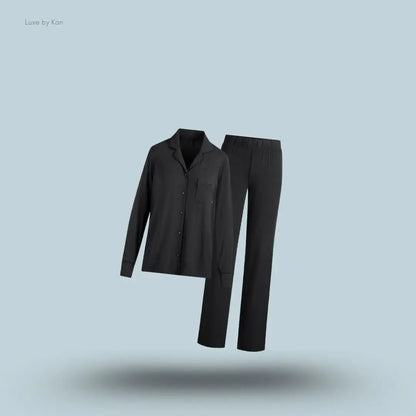 SKIMS Sleep Long Sleeve Button Up Set in Onyx, flat lay on light blue background