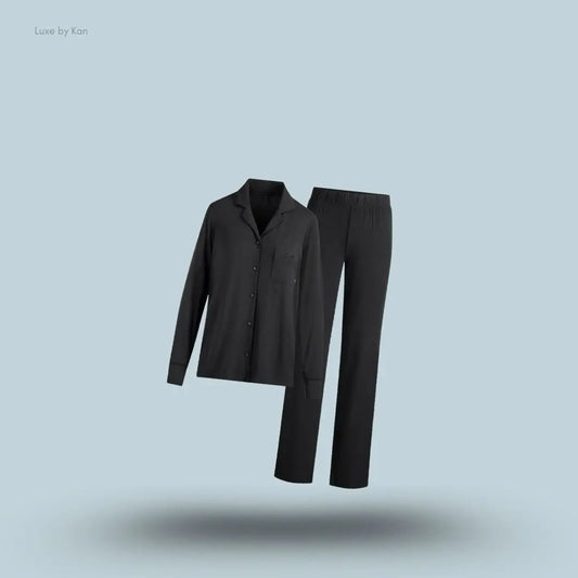 SKIMS Sleep Long Sleeve Button Up Set in Onyx, flat lay on light blue background