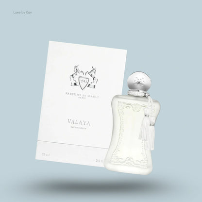 Parfums de Marly Valaya Eau de Parfum in a decorative glass bottle with a silver cap and tassel, displayed beside its box.