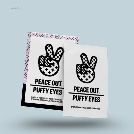 Two packages of "Peace Out Puffy Eyes" under-eye patches, featuring black and white designs with a peace sign and bold text.
