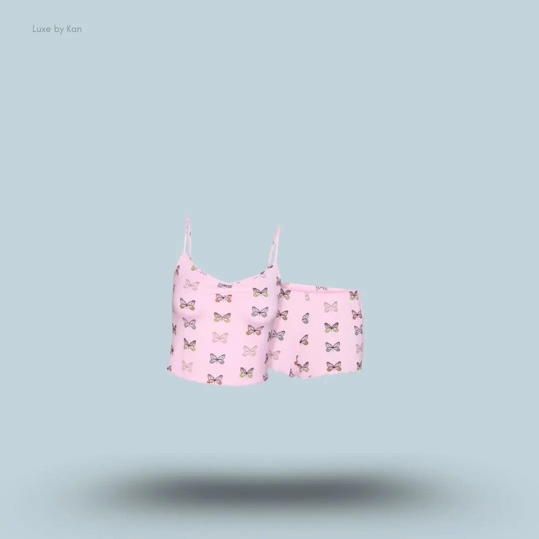 SKIMS Sleep Cami Set in Peony Butterfly Print, flat lay on light blue background