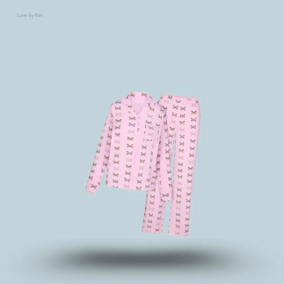 SKIMS Sleep Long Sleeve Button Up Set in Peony Butterfly Print, flat lay on light blue background