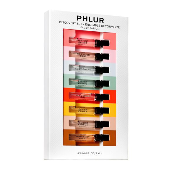 A PHLUR discovery set featuring eight 2 mL perfume vials with unique scents named Apricot Précis, Not Your Baby, and more.