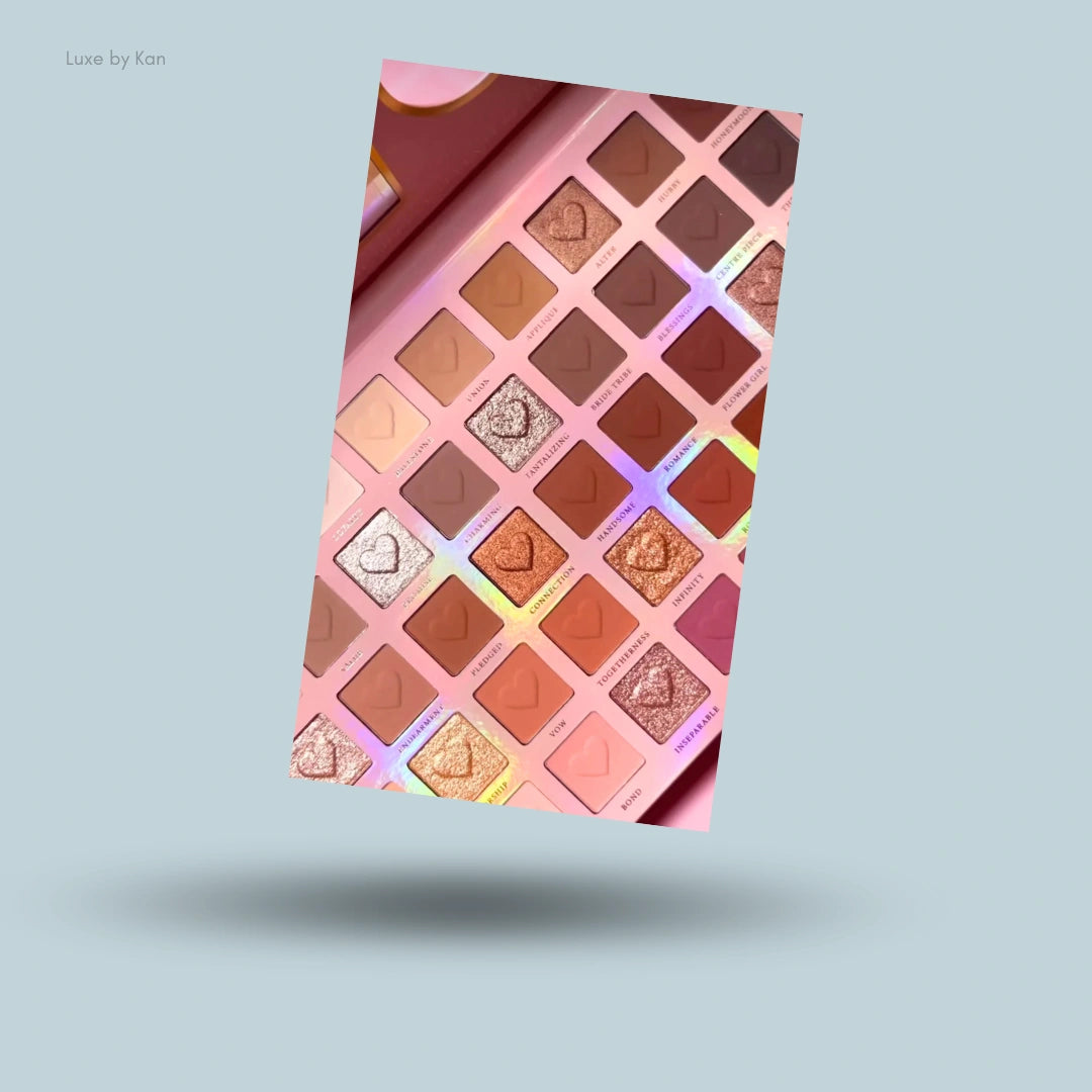 Open the P.Louise Bridal Series Wedding Wish XL Palette to see many heart-shaped eyeshadows in a large pink makeup case.