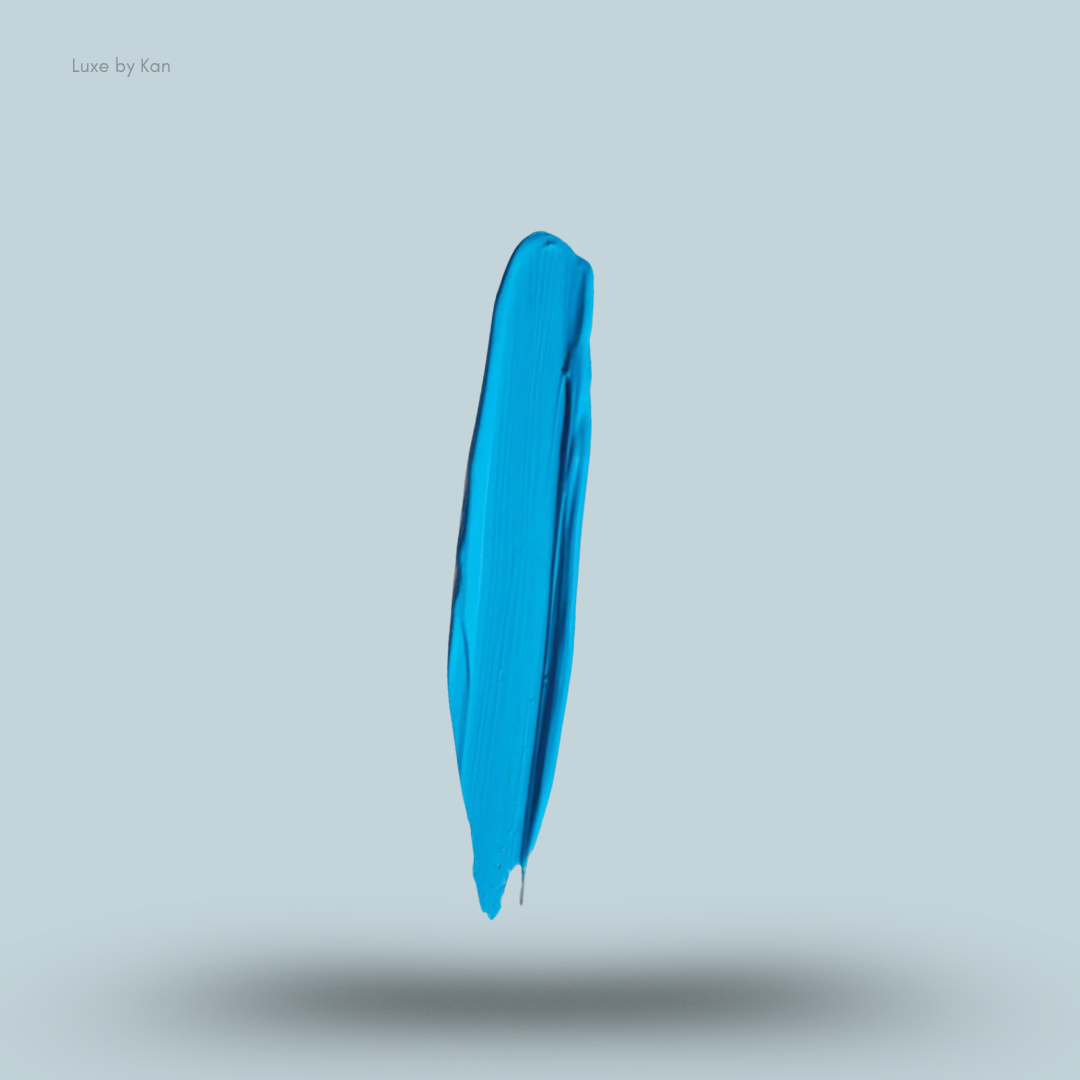 Stroke of vibrant turquoise Plouise cosmetic base floating against a soft grey background.