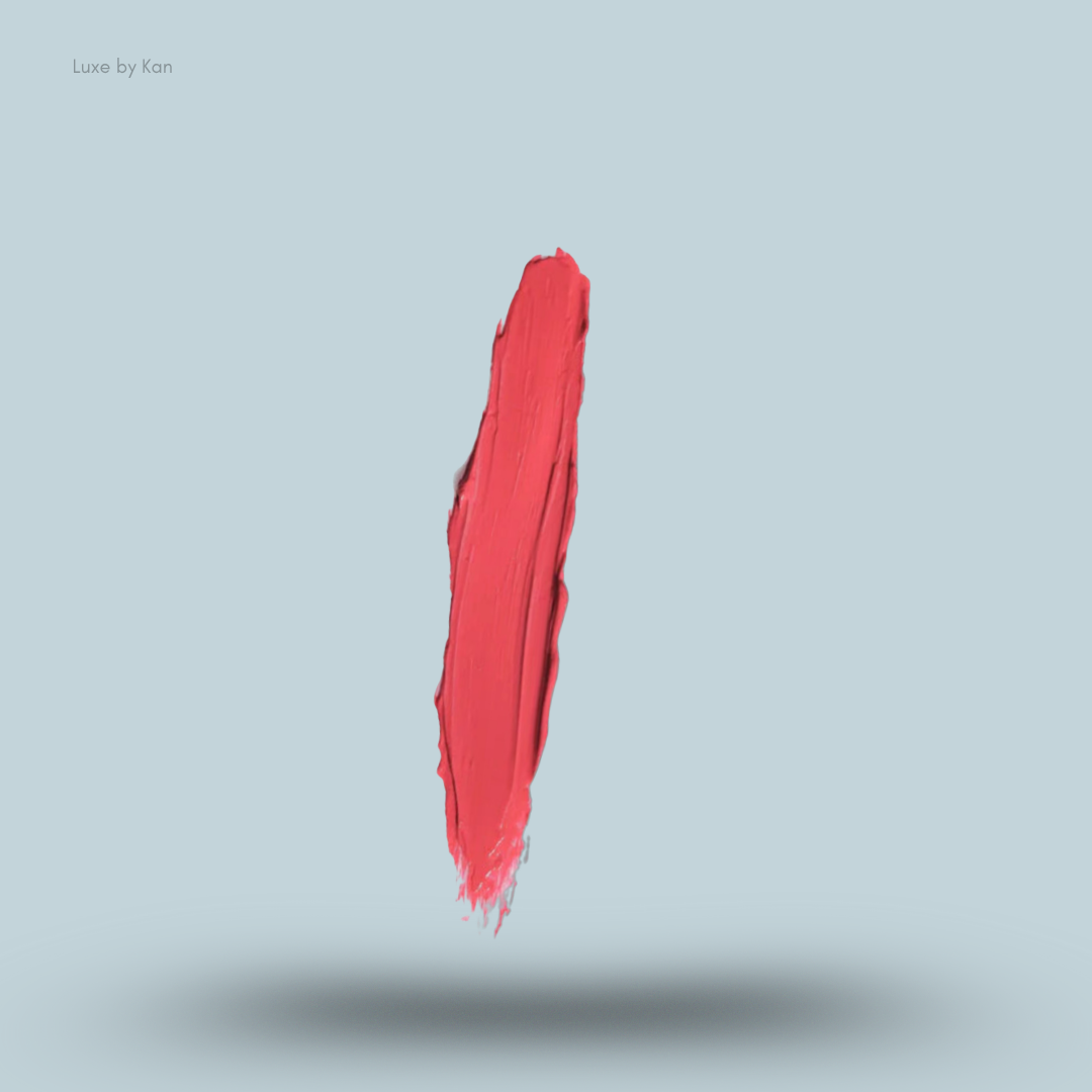 Vertical smear of Plouise colored makeup base in coral-red.