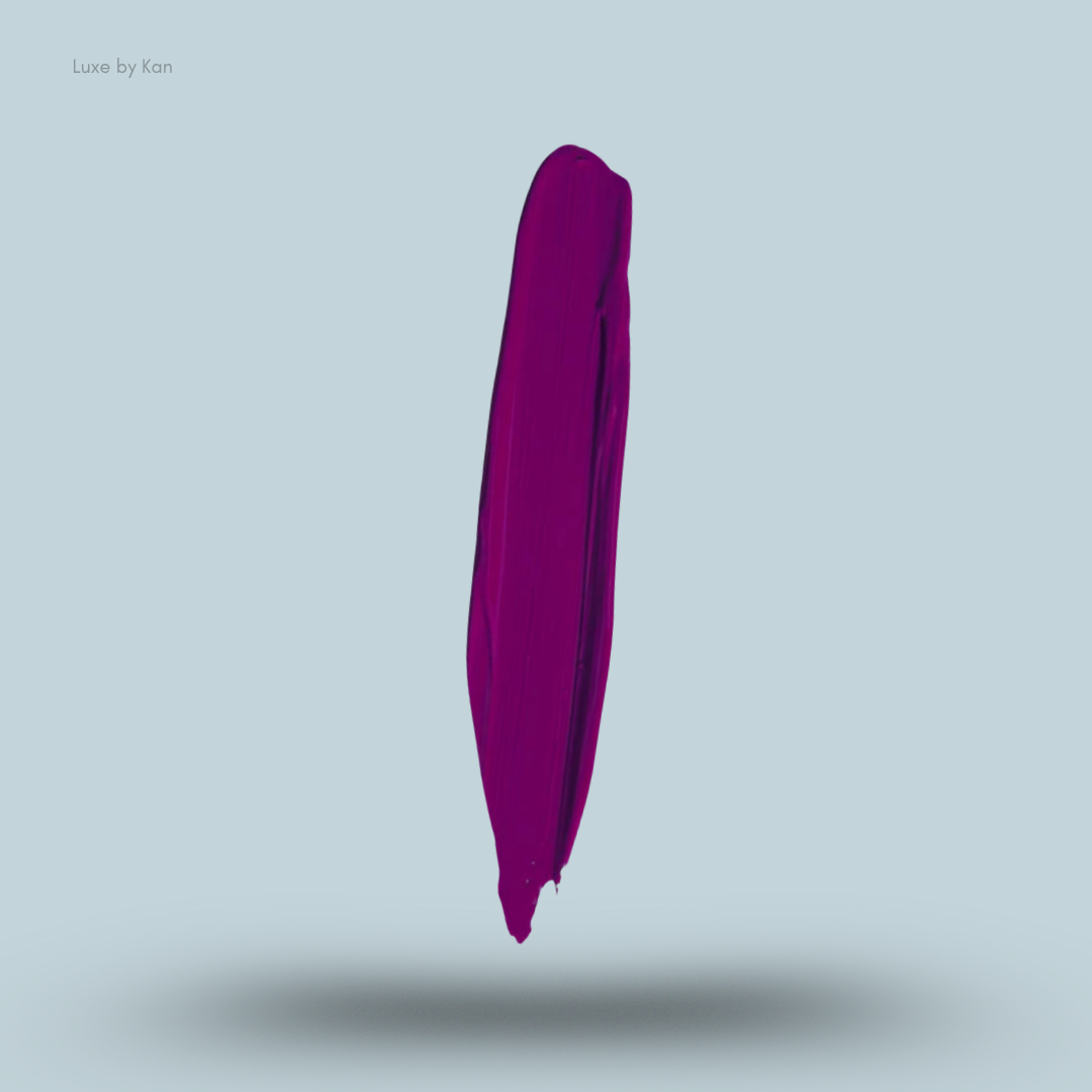 Vertical smear of deep magenta Plouise makeup base against a light blue background.