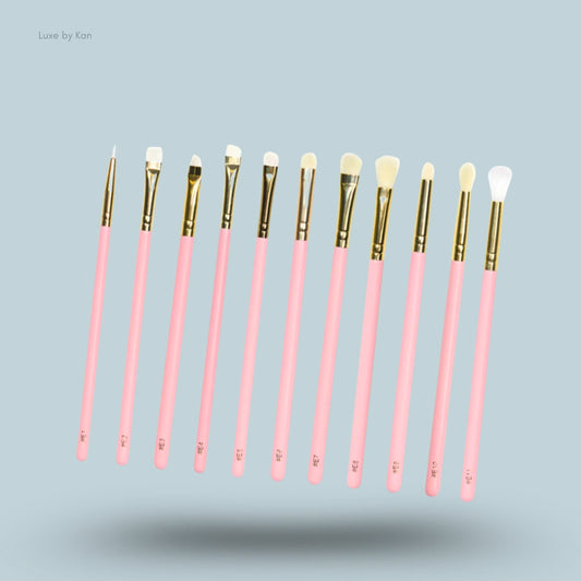 Plouise precise with my destiny brush set, featuring eleven brushes with pink handles and gold ferrules.