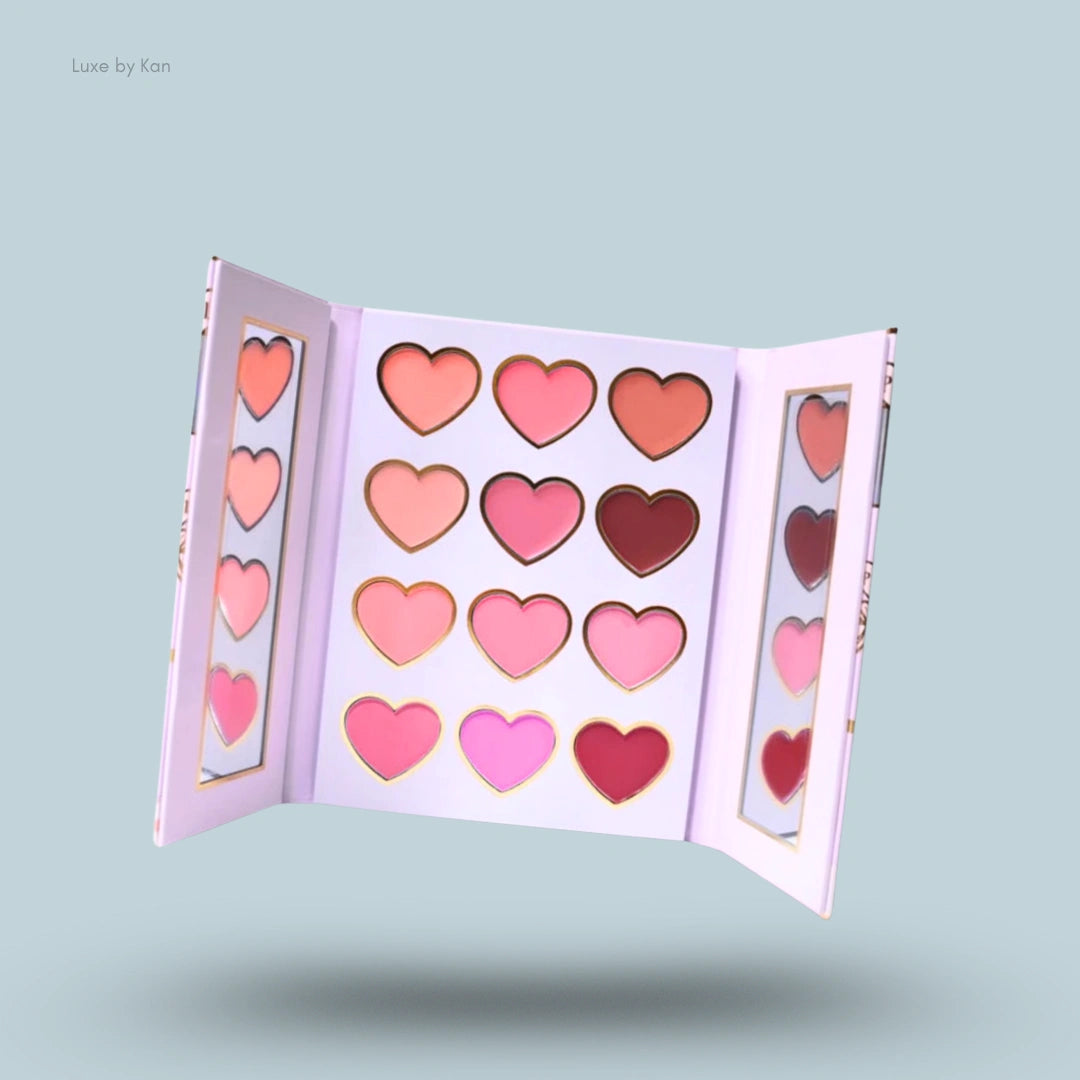 Open lip palette featuring 16 heart-shaped shades in pinks and nudes, with a sleek design and elegant gold detailing.