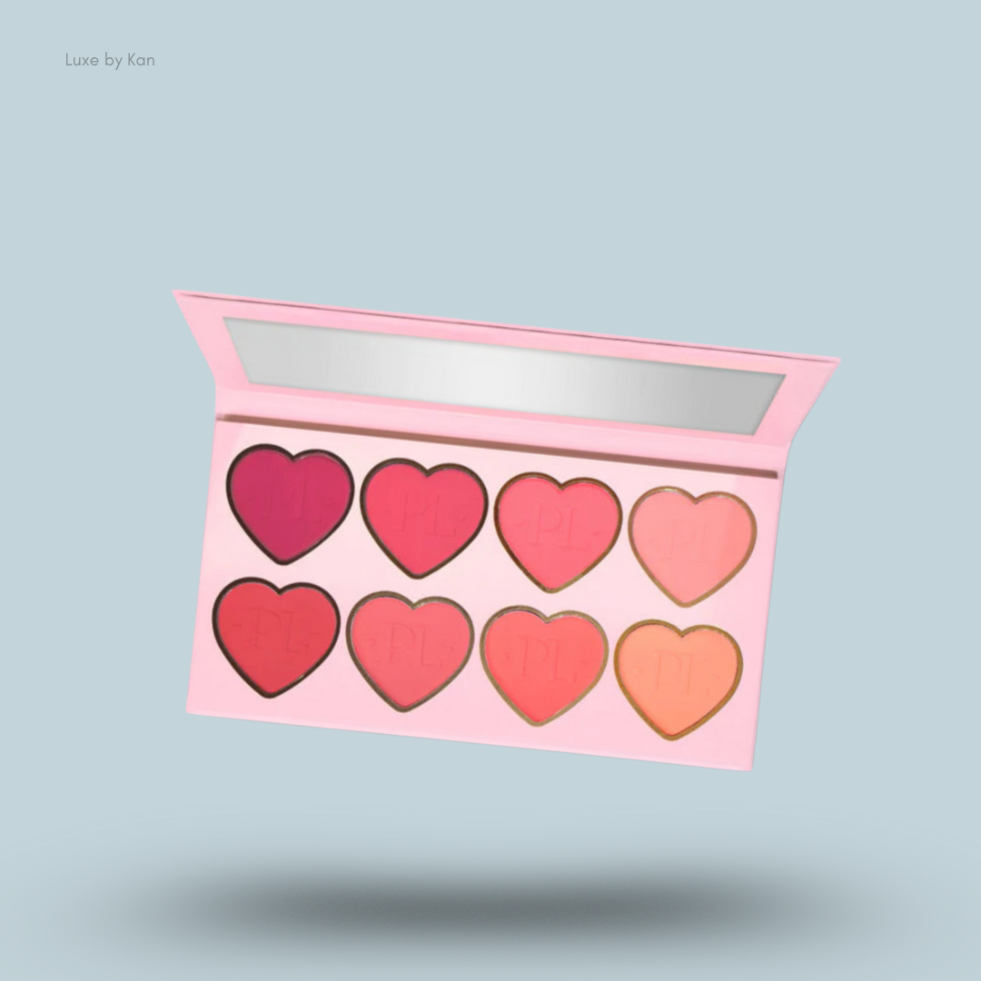 Plouise Wrap It Up blusher palette, open, revealing eight heart-shaped blush shades from deep to light pink, peach and coral.