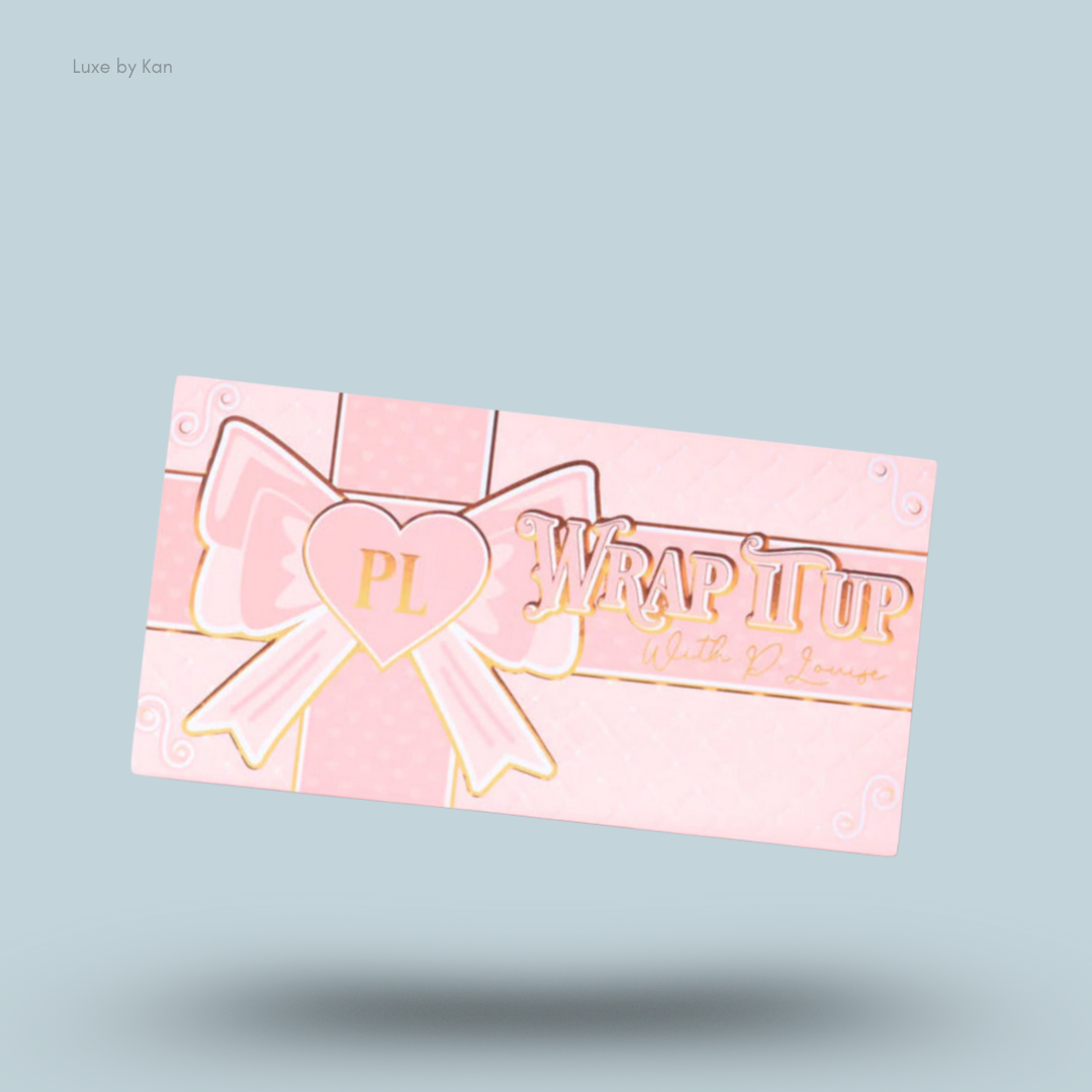 Plouise "Wrap It Up" blusher palette in light pink packaging decorated with a large pink bow and gold lettering.