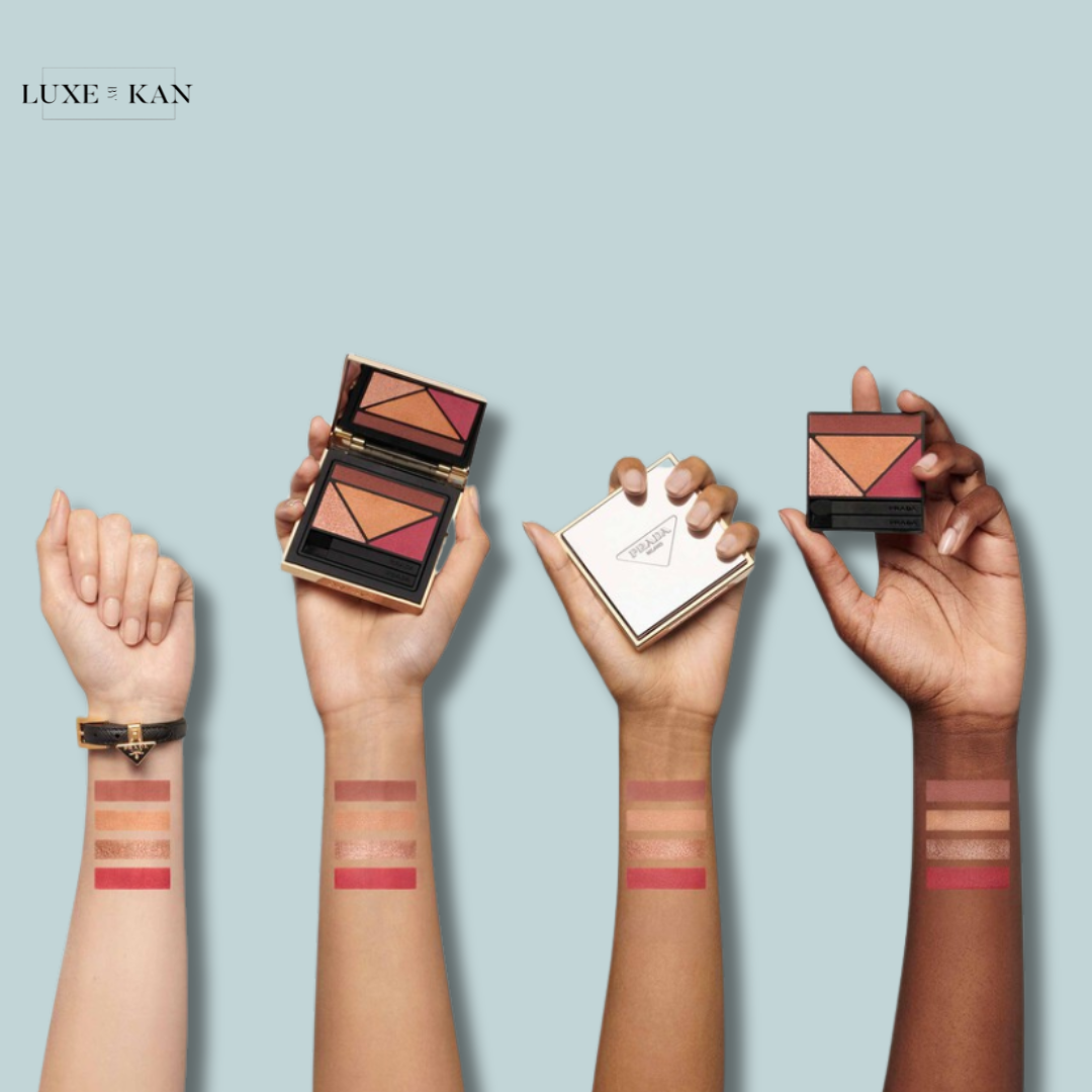 Four diverse hands showcase various makeup compacts and swatches of blush shades on their arms against a light blue background.