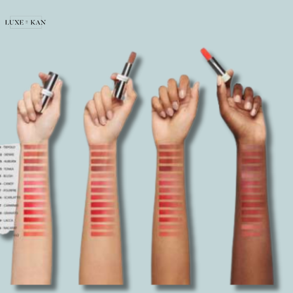 Four hands showcase various prada lipstick shades with swatches on their arms, highlighting diverse color options.