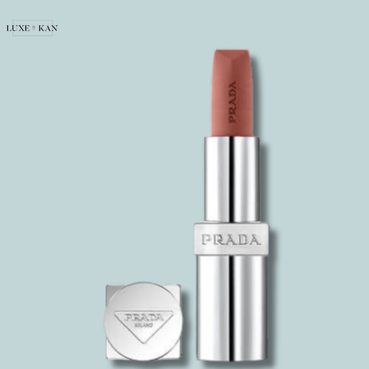 Prada lipstick in a silver tube, topped with a muted pink shade.