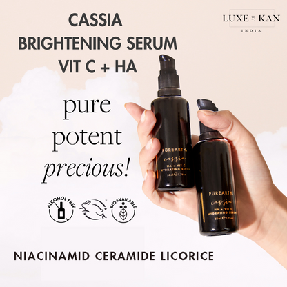 Two dark glass serum bottles labeled "Cassia Brightening Serum" against a soft background, highlighting their key ingredients and benefits.