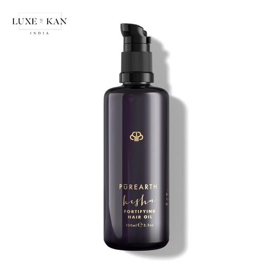 A sleek dark bottle of Purearth Kesha Fortifying Hair Oil, featuring a pump top.