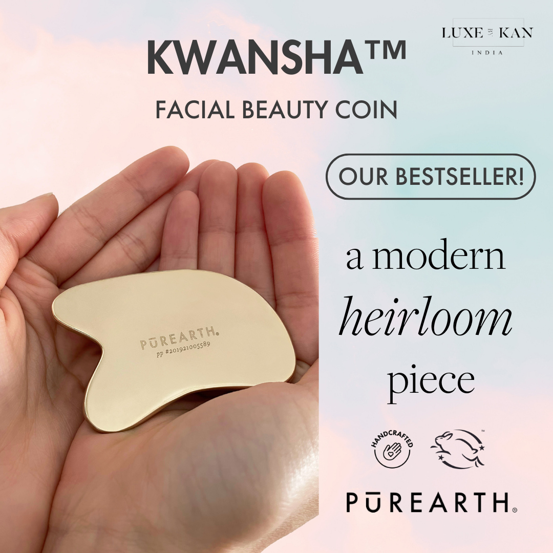 A hand holds a gold facial beauty coin labeled "PUREARTH." Text highlights it as a bestseller and describes it as a modern heirloom piece by Luxe & Kan India.