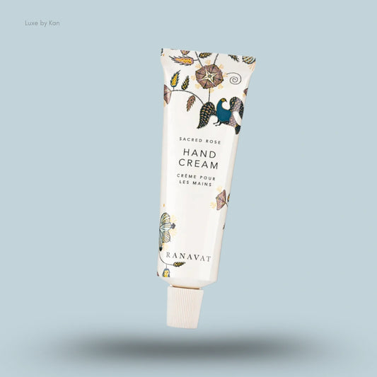 Ranavat Sacred Rose hand crème tube with floral and peacock design.