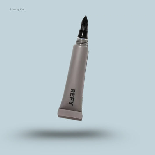 Refy Lip Buff tube with a black brush applicator.