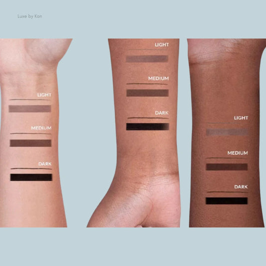 Swatches of makeup shades on three diverse skin tones labeled as Light, Medium, and Dark for guidance on color matching.