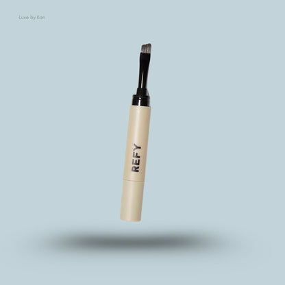 Refy brow sculpting pomade with applicator brush.