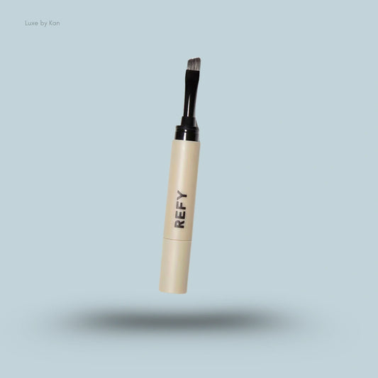 Refy brow sculpting pomade with applicator brush.