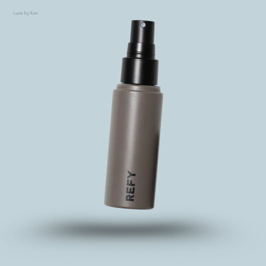 Refy face setter setting spray with a gray bottle and black spray nozzle.