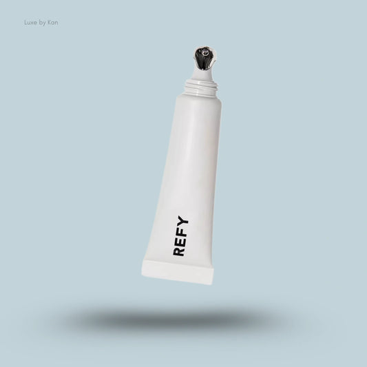 Refy tinted lip gloss in white tube with chrome applicator.