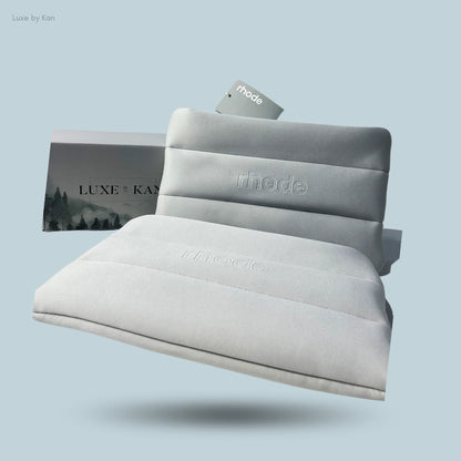 Light gray bubble cosmetic bag with "Rhode" debossed, displayed in front of a "Luxe by Kan" box.